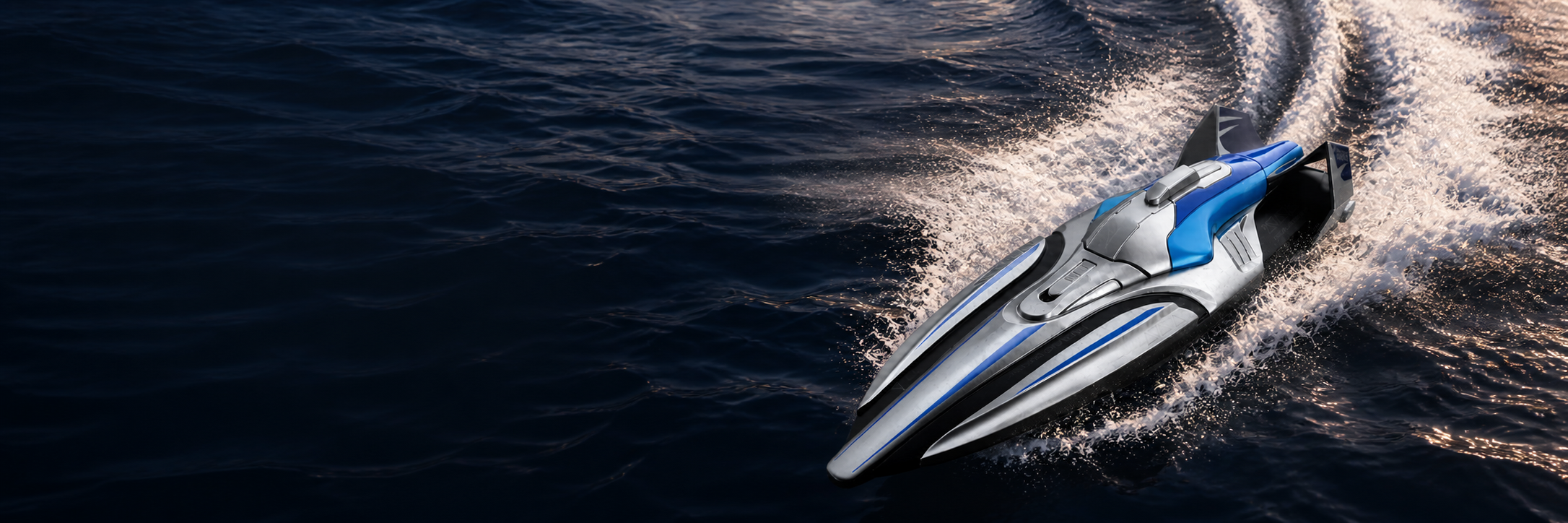 The V30 Velocity at full throttle, wake fanning out behind the hull